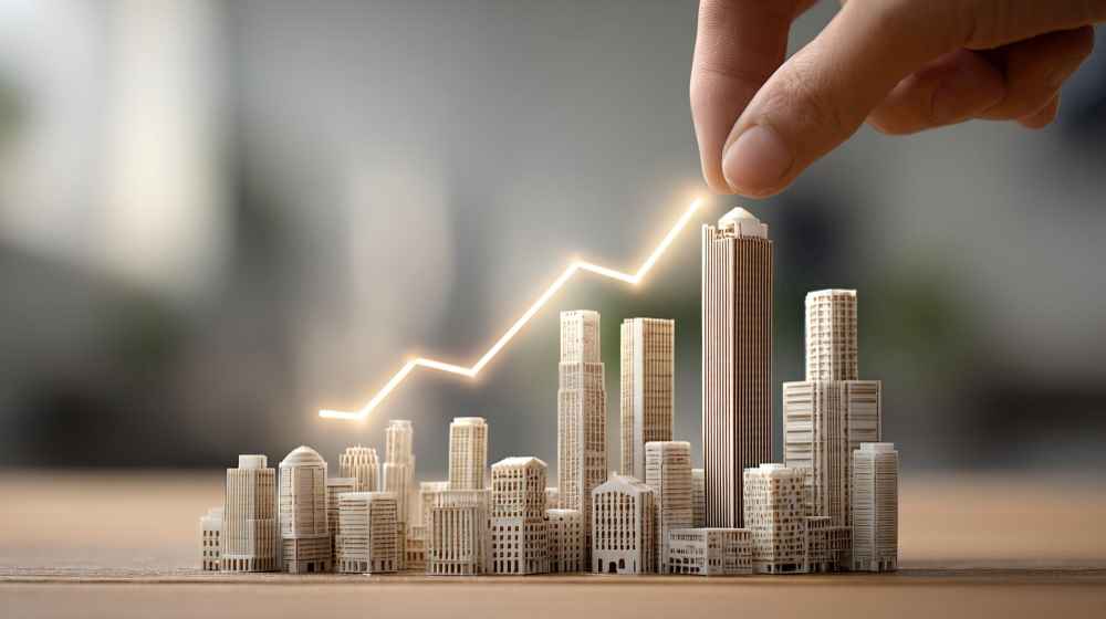 REITs(Real Estate Investment Trusts,不動產投資信託) 是一種將眾多投資人的資金集中起來,統一投資於不動產相關資產的投資工具。簡單來說,這就像是「不動產版本的基金」——眾多投資人將資金匯集在一起,委託專業機構去購買辦公大樓、購物中心、倉儲物流中心等商業不動產,再將所產生的租金收益定期分配給所有投資人。